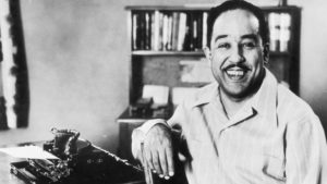 Langston Hughes at his typewriter in Harlem
